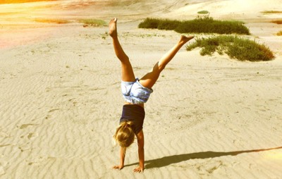 handstand on the beach